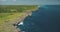 Green rocky shore of ocean gulf aerial view. Cliff sea coast with serene seascape. Amazing landscape