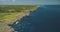 Green rocky shore of ocean gulf aerial view. Cliff sea coast with serene seascape. Amazing landscape