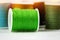 The green roll of thread on background,needlework,craft,sewing