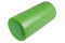 Green roller for Pilates, yoga or for fitness, on a white background, warming up and back muscle massage