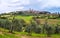 Green rolling hills and old town of San Gimignano