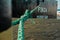 Green rope on a bollard, which the freighter Finja from Cuxhaven holds on the pier