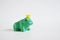 Green rubber toy frog on a white background