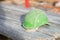 Green safety helmet on metal tubes