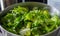 Green salad in a stainless steel bowl