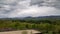 Green scenery mountain landscape with storm clouds