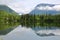 Green scenery and reflections on lake Odensee in Pichl Kainisch, Bad Aussee, Salzkammergut, Styria, Austria, Europe