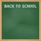 Green school board with chalk inscription Back to School.