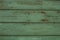 Green scratched wooden board. Wood texture