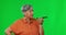 Green screen, angry and woman with phone call, speaker and talking against studio background. Mature female, loud or