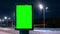 Green screen billboard on a busy highway with traffic, neon lights