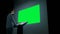 Green screen chroma key concept - woman looking at empty large wall display