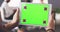 Green screen, chromakey and tracking markers on tablet showing marketing, advertising or copyspace closeup. Hand holding