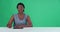 Green screen, face and woman talking as reporter, journalist and broadcast in mockup newsroom. Portrait of black female