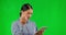 Green screen, glitch and Asian woman with a tablet, stress and frustrated employee against a studio background. Female