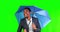 Green screen, happy and business black man with umbrella for rain, winter season and weather. Travel, professional and