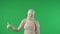 Green screen isolated chroma key photo capturing a mummy showing something with its hand and giving a thumbs up