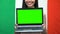 Green screen laptop in female hands, Italy flag background, education, traveling