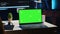 Green screen laptop in home office used for developing software applications