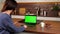 Green screen laptop woman greets talking listens online video call webcam chat