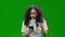 Green Screen portrait young woman spend money online