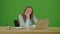 Green Screen. Tired Woman Typing on Laptop Working on Internet, Doing Online Job