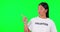 Green screen, volunteer and a woman pointing at space for advertising, charity or information. Happy asian person with