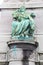 Green sculpture of women in Brussels.