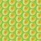 Green seamless pattern with yellow watercolor circles.