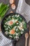 Green shakshuka. Fried eggs with wild garlic and feta cheese