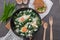 Green shakshuka. Fried eggs with wild garlic and feta cheese