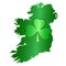 Green shamrock symbol and Ireland silhouette on white background