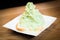 Green shaved ice with bread