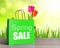 Green shopping bag with spring sale word