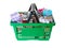 Green shopping basket with different gifts on white