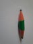 Green short pencil that is sharpened on both sides, bullet shaped