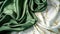 Green silk fabric decorated with white silk fabric looks like white and gold marble stone color accents.