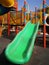 Green slide in the playground.