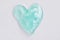 Green slime for kids in a heart shape,