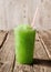 Green Slushie Drink in Plastic Cup with Straw