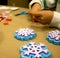 Green small paintbrush with snowflake stampers and childs hands