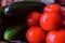 Green smooth cucumbers and red ripe tomatoes