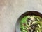 Green smoothie bowl with hemp seeds, buckwheat, pumpkin seeds and kiwifruit