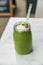 Green smoothie detox cleanse drink at cafe restaurant morning breakfast meal replacement for weight loss diet. Healthy eating