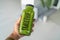 Green smoothie healthy drink bottle woman taking first person view food selfie holding juice at home for detox diet