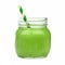 Green smoothie in a mason jar with paper straw isolated on white