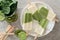 Green smoothie popsicles on a marble plate, above view