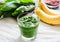 Green smoothie with spinach, kiwi, mint and banana, summer