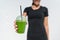 Green smoothie waitress woman serving cup at cafe