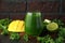 Green smoothies with kale and mango on wooden table